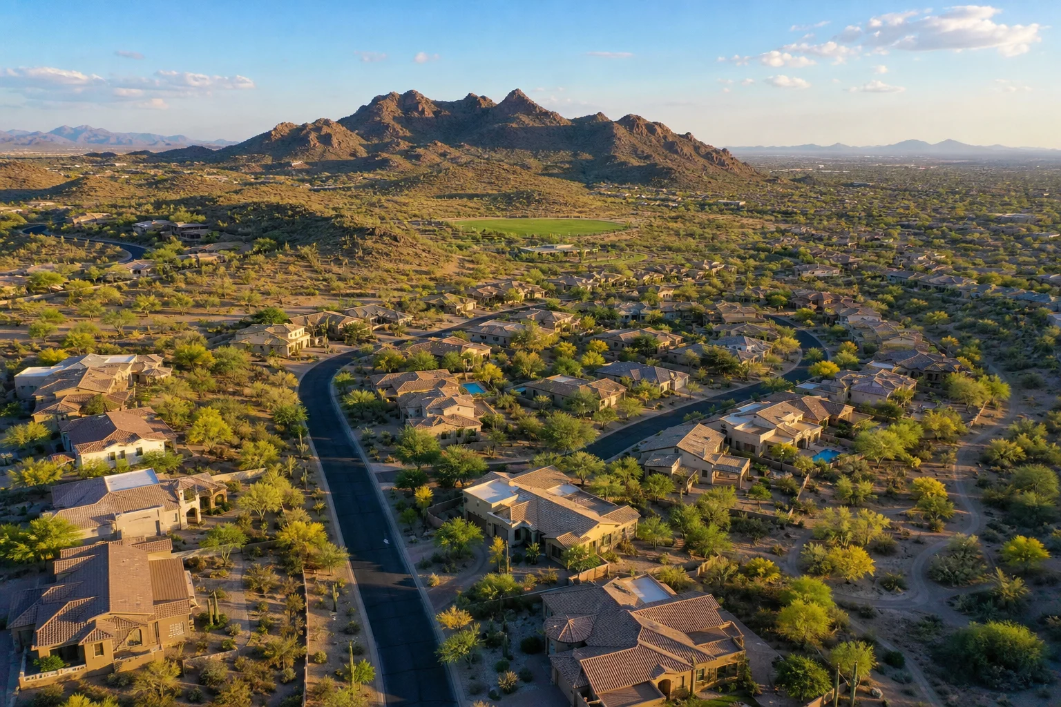 Aerial view of Ahwatukee Foothills neighborhood in Phoenix AZ with South Mountain and the desert valley visible in the background