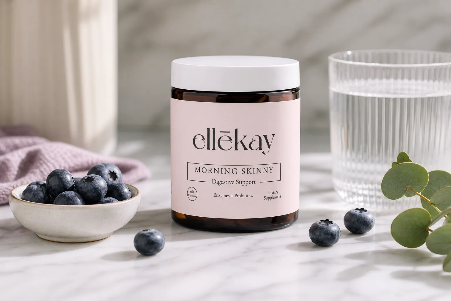 Morning Skinny supplement bottle on a marble counter with fresh berries representing akkermansia muciniphila supplements vs other probiotics for women's gut health
