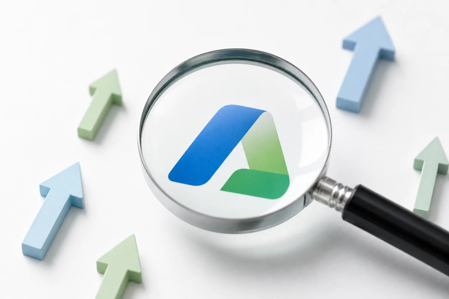Magnifying glass over a brand logo symbolizing the brand search index and organic search visibility growth