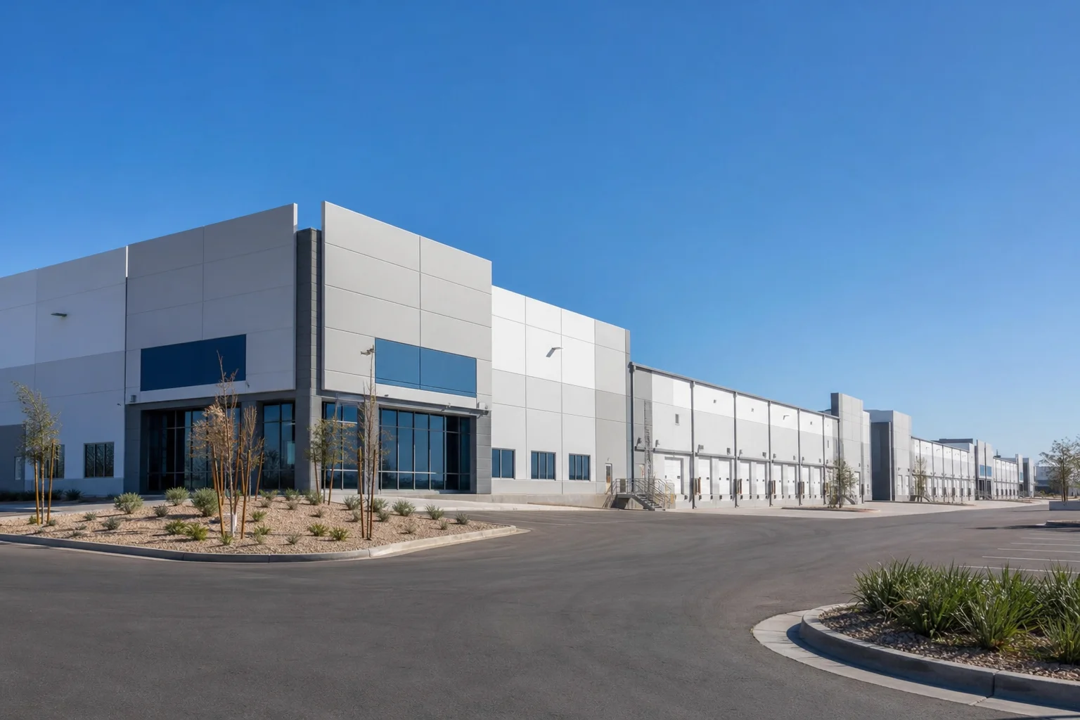 Commercial industrial park in Phoenix metro with multiple tenant warehouse buildings under clear desert sky