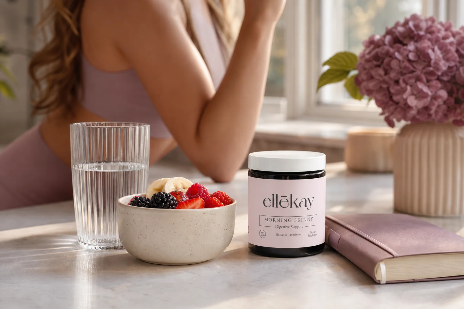 Woman's morning wellness routine featuring gut health and PCOS support essentials on a kitchen counter
