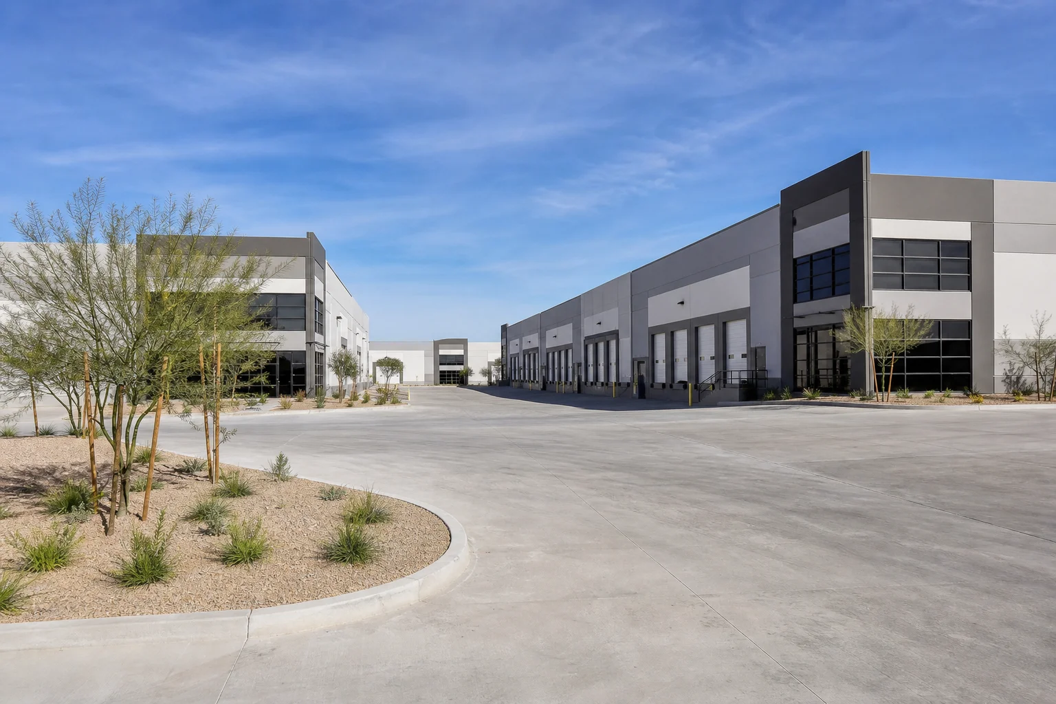 Aerial view of Phoenix metro industrial park with flex and distribution warehouse buildings along a freeway corridor