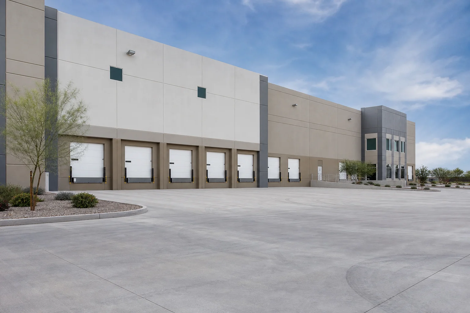 Modern Phoenix industrial warehouse facility with loading docks and truck courts in the East Valley representing a sale-leaseback opportunity for owner-operators